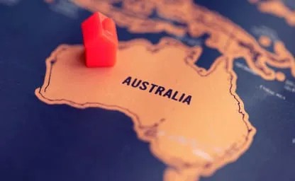Down Under - Toy House on Australian Map Toy house on a map at the location of Australia
