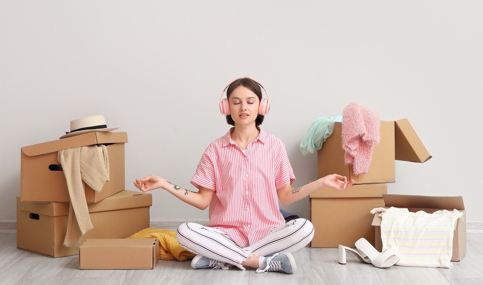 Zen Moving - Meditation During Relocation Woman meditating surrounded by moving boxes