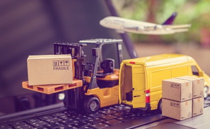 Mini Logistics - Model Forklift and Transport Vehicles Miniature forklift with a box labeled fragile near a delivery van and airplane